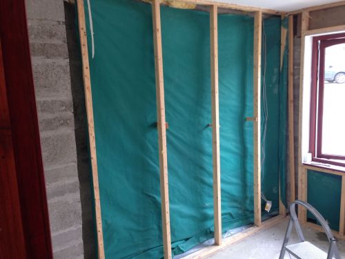 The old frame before it was built out slightly to allow insulation around the stone column